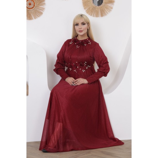 A burgundy-colored evening dress, made of fine fabric and embroidered with flowers